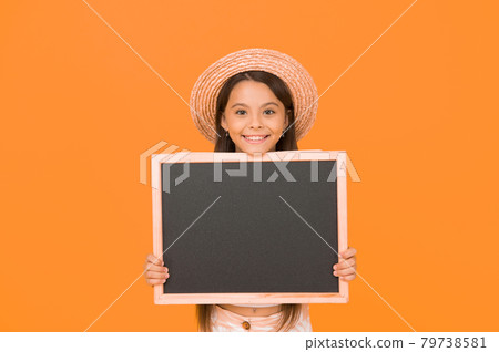 Knowledge day. happy small girl hold board. advertising Knowledge day. happy small girl hold board. advertising 79738581