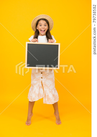 summer holiday is here. cheerful little girl with blackboard summer holiday is here. cheerful little girl with blackboard 79738582