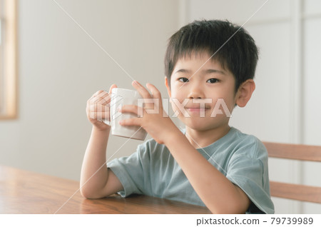 A boy taking a break with a drink A boy taking a break with a drink 79739989