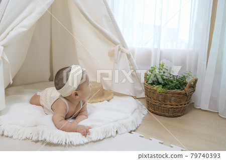 Lovely baby under the Indian tent (baby tent) Lovely baby under the Indian tent (baby tent) 79740393