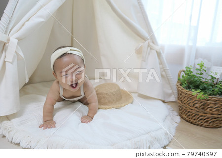 Lovely baby under the Indian tent (baby tent) Lovely baby under the Indian tent (baby tent) 79740397