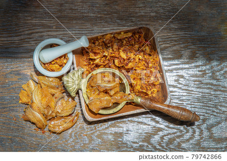 Dried chilli paste with crispy fish thai style or Crispy fish chilli paste on wooden bowl. Dried chilli paste with crispy fish thai style or Crispy fish chilli paste on wooden bowl. 79742866