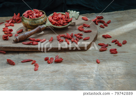 Red goji Berries (dried) on the rustic style old table. 79742889