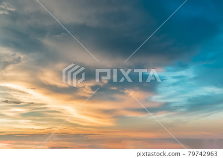 The sun shines through the clouds in the sky. The shape of the clouds evokes imagination and creativity. They can be used as wallpapers that look amazing. The sun shines through the clouds in the sky. The shape of the clouds evokes imagination and creativity. They can be used as wallpapers that look amazing. 79742963
