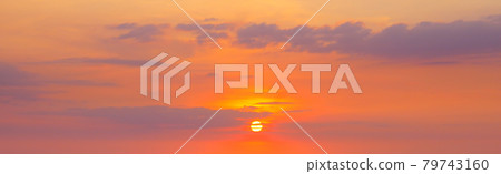 strong sunrise and cloud on the orange sky. Wide photo. 79743160