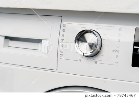 New washing machine in a home appliances store New washing machine in a home appliances store 79743467