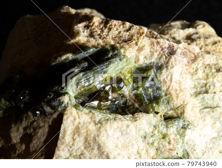 Blotting of green actinolite mineral crystals in rock from Ural, Russia. For geology websites, stone collection catalog, Natural Science museum wall chart. Blotting of green actinolite mineral crystals in rock from Ural, Russia. For geology websites, stone collection catalog, Natural Science museum wall chart. 79743940