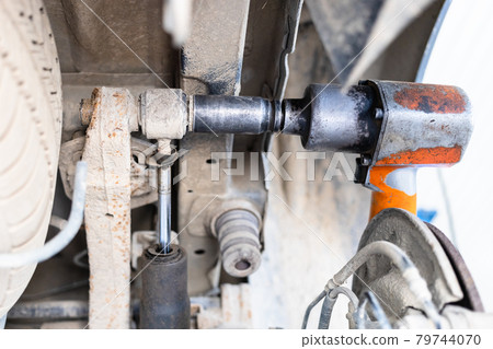 disassembling of broken car shock absorber disassembling of broken car shock absorber 79744070
