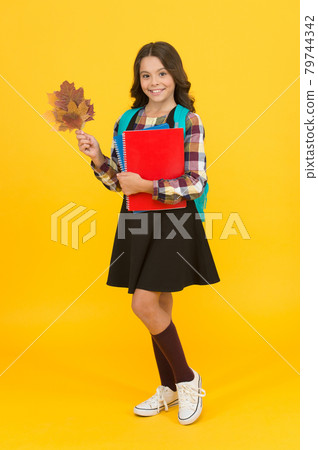Care and concern, a school return. Happy little girl back to school Care and concern, a school return. Happy little girl back to school 79744342