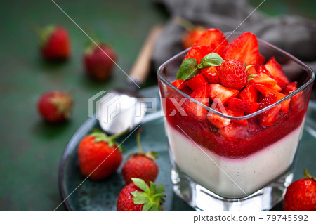 Delicious Italian dessert Panna Cotta with fresh summer strawberries 79745592