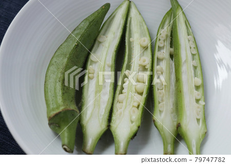 Okra cut in half vertically Okra cut in half vertically 79747782