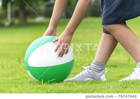 Children playing on the grass 79747848