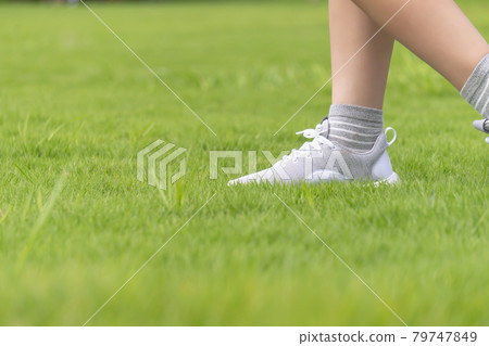 Children playing on the grass 79747849