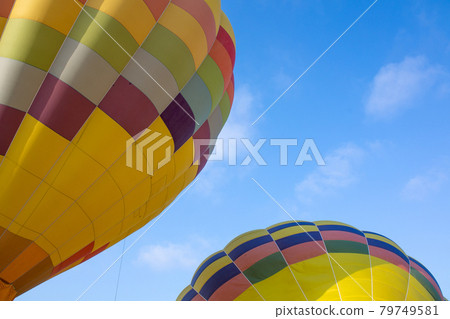 Colorful hot air balloons over blue sky 79749581