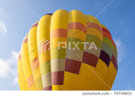 Colorful hot air balloons over blue sky 79749603