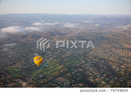 Colorful hot air balloons on the sky over San Diego. Colorful hot air balloons on the sky over San Diego. 79749604