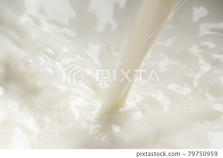 Pour milk close-up 79750959