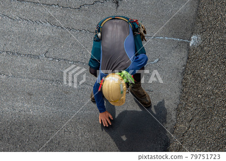 Asphalt paved road repair work Asphalt paved road repair work 79751723