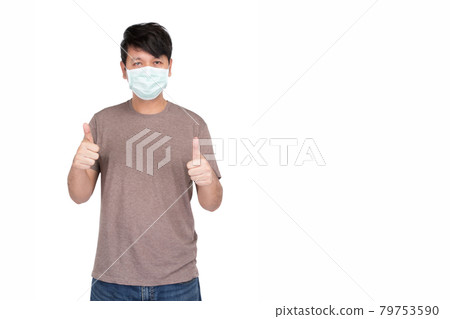 Asian man wearing surgical protection face mask and showing thumbs up by two hands, symbol of felling good, studio light isolated on white background, concept for coronavirus, COVID19 Asian man wearing surgical protection face mask and showing thumbs up by two hands, symbol of felling good, studio light isolated on white background, concept for coronavirus, COVID19 79753590