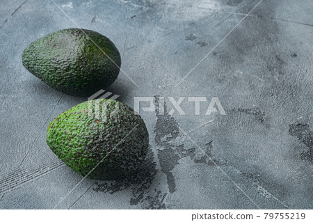 Ripe pair of green avocado, on gray background with copy space for text 79755219