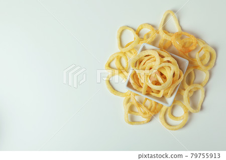 Bowl with tasty snacks on white background Bowl with tasty snacks on white background 79755913