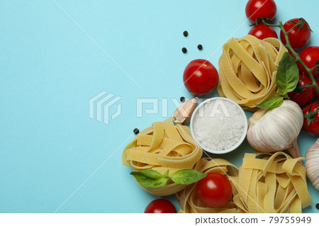 Concept of cooking tasty pasta on blue background 79755949