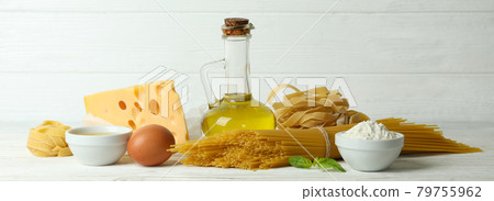Concept of cooking tasty pasta on white wooden background Concept of cooking tasty pasta on white wooden background 79755962