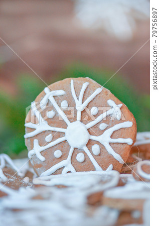 Christmas cookies, fir festive decoration. Gingerbread on wooden background Christmas cookies, fir festive decoration. Gingerbread on wooden background 79756897