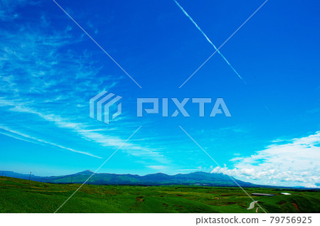 View of the Yamanami Highway and Kuju Mountain Range from the grasslands of Aso Outer Ring View of the Yamanami Highway and Kuju Mountain Range from the grasslands of Aso Outer Ring 79756925