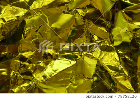 Crumpled yellow gold paper texture. 79758120