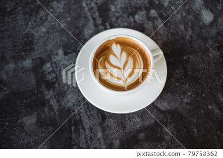 Latte art coffee on wooden table in coffee shop 79758362