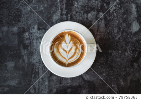 Latte art coffee on wooden table in coffee shop 79758363