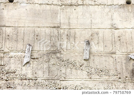 Concrete wall surface with holes and traces of formwork, concrete background 79758769