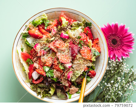 Fresh summer healthy fiber protein vitamin salad in bowl with strawberries, lettuce, tuna, tomatoes Fresh summer healthy fiber protein vitamin salad in bowl with strawberries, lettuce, tuna, tomatoes 79759072
