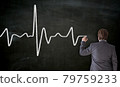 Heartbeat is painted on blackboard by businessman 79759233