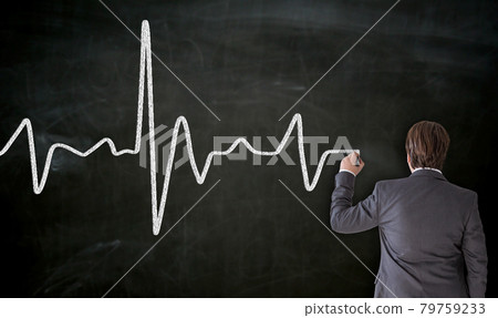 Heartbeat is painted on blackboard by businessman Heartbeat is painted on blackboard by businessman 79759233