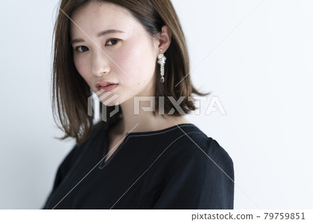 A woman in a black dress 79759851