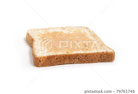 Bread with peanut butter isolated on white background. Homemade cooking and baking. Breakfast. Food, toasts, ingredients and bakery supplies in kitchen, bakery preparation. 79761748