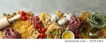 Concept of cooking pasta on gray textured background Concept of cooking pasta on gray textured background 79761963