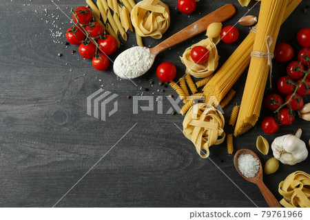 Concept of cooking tasty pasta on dark wooden background Concept of cooking tasty pasta on dark wooden background 79761966