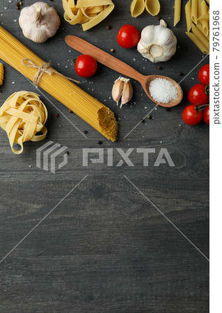 Concept of cooking tasty pasta on dark wooden background Concept of cooking tasty pasta on dark wooden background 79761968