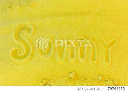 The word sunny is written on a yellow beach sand background. Sign or symbol of sunny concept The word sunny is written on a yellow beach sand background. Sign or symbol of sunny concept 79763255