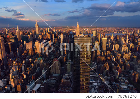 New York City Manhattan sunset skyline panorama view. Stunning and magnificent view of famous city. New York City Manhattan sunset skyline panorama view. Stunning and magnificent view of famous city. 79763276