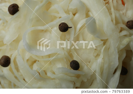 Sauerkraut and peppercorns on whole background, close up 79763389