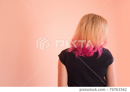 Girl with perfect healthy pink colored hair. Fashion model woman blonde and pink hair Girl with perfect healthy pink colored hair. Fashion model woman blonde and pink hair 79763562