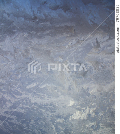 Textured frost patterns on the glass. A cold frosty day in winter. Textured frost patterns on the glass. A cold frosty day in winter. 79768053