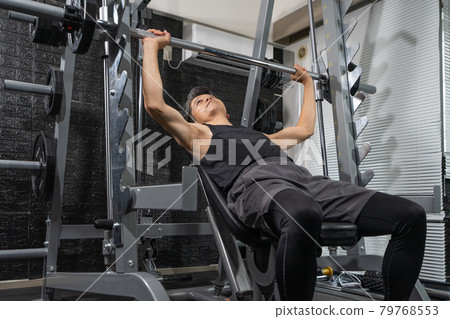 Middle-aged man training in the gym Middle-aged man training in the gym 79768553