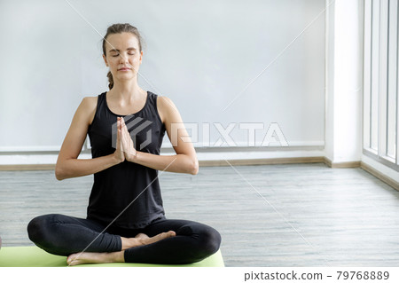 Caucasian woman exercise doing the yoga pose stretching at home, healthy lifestyle concept Caucasian woman exercise doing the yoga pose stretching at home, healthy lifestyle concept 79768889