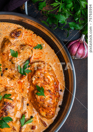 Cajun chicken in a creamy sauce prepared in a pan Cajun chicken in a creamy sauce prepared in a pan 79768994