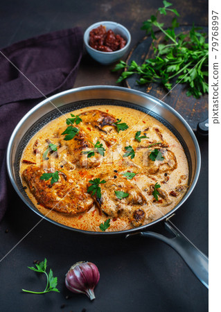 Cajun chicken in a creamy sauce prepared in a pan Cajun chicken in a creamy sauce prepared in a pan 79768997